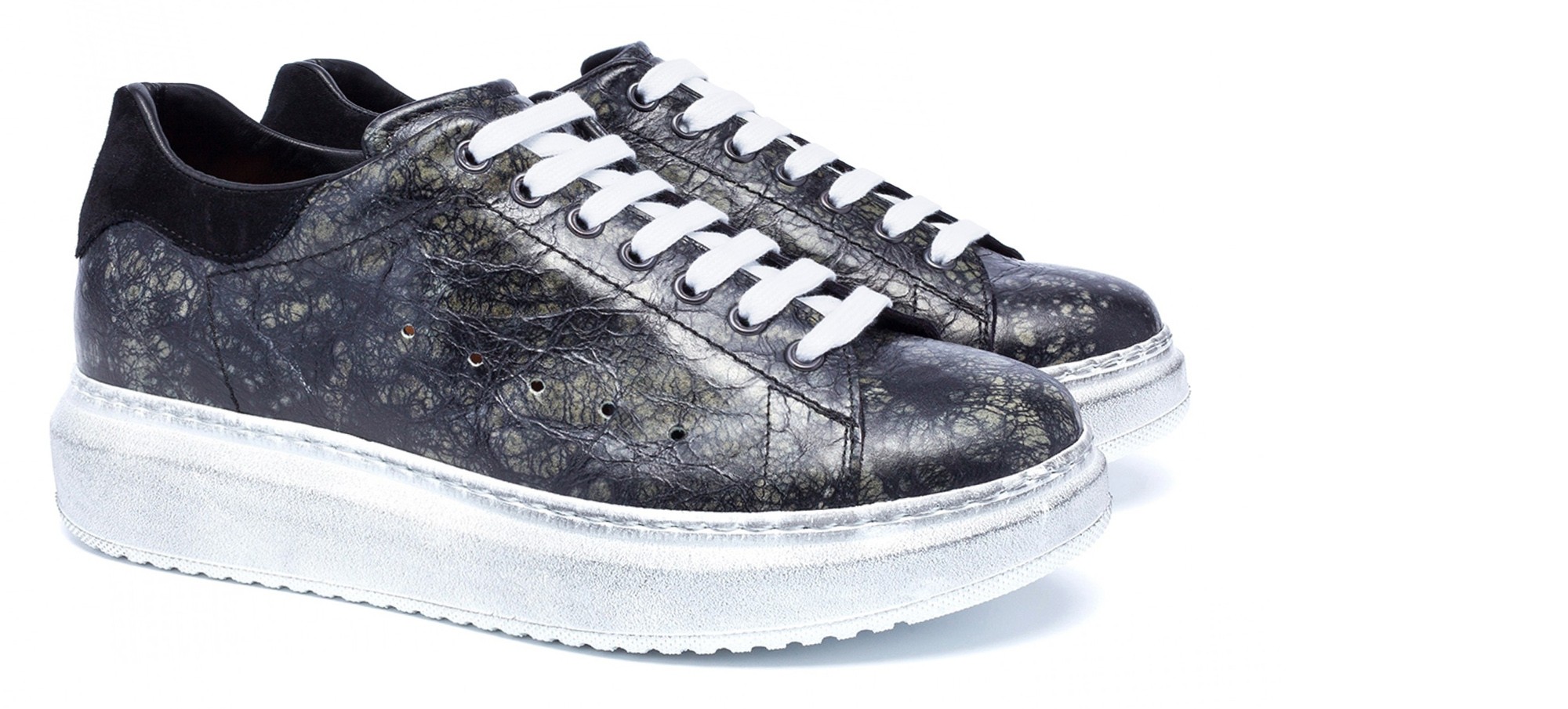 scarpe artigianali con rialzo